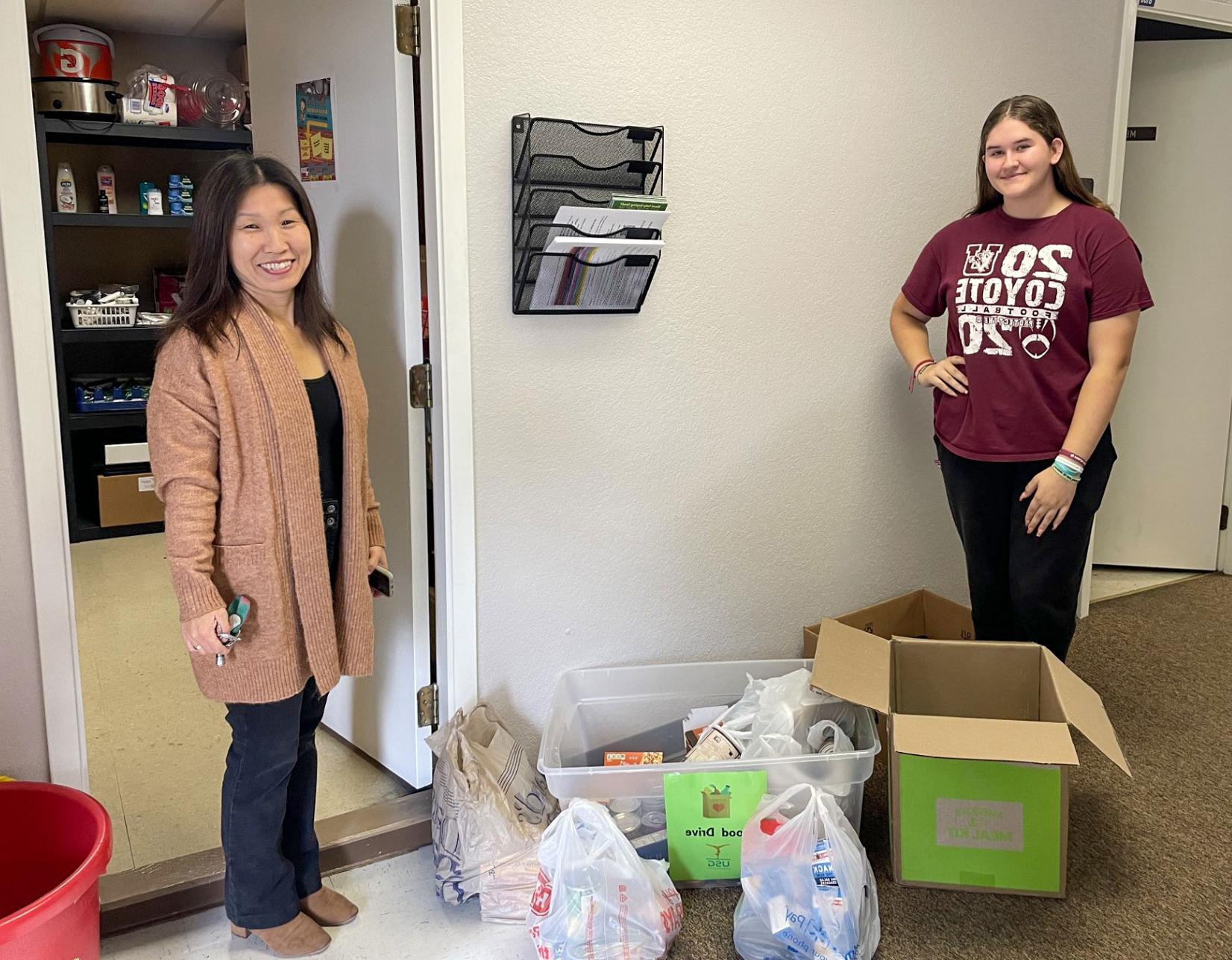 Donations to the Food Pantry are pictured with Food Pantry Staff and Kim Knape from Uvalde School of Gymnastics.